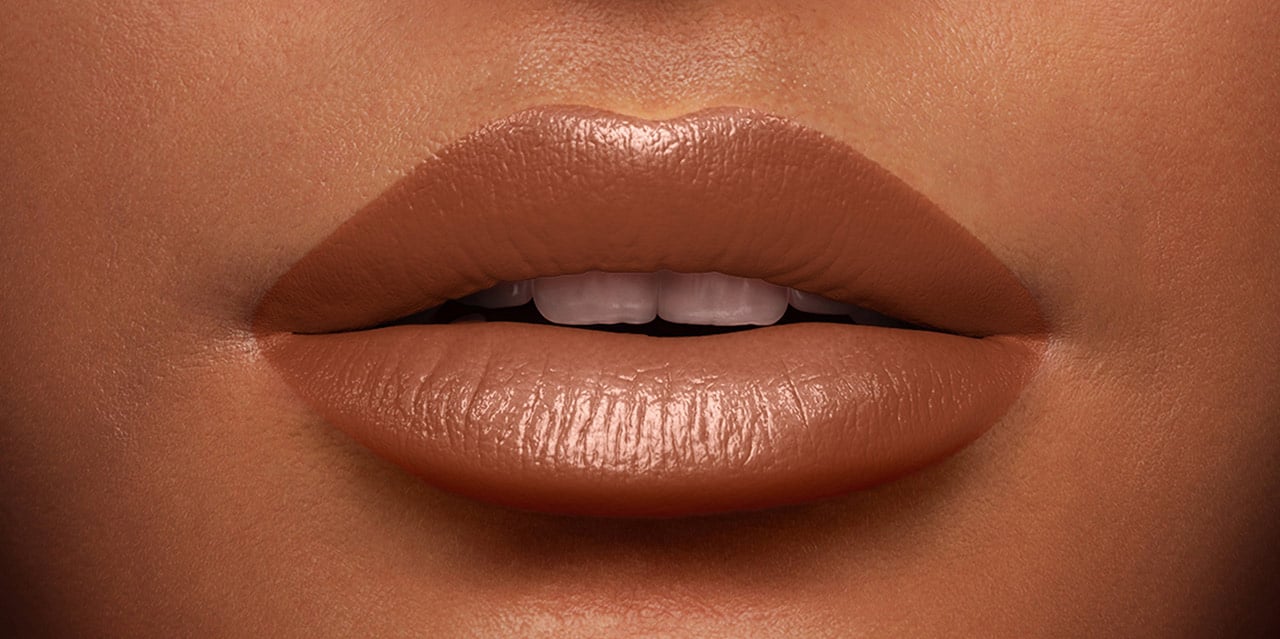 Natural Looking Nude Lipstick in a cream finish worn on a Dark Skin Tone
